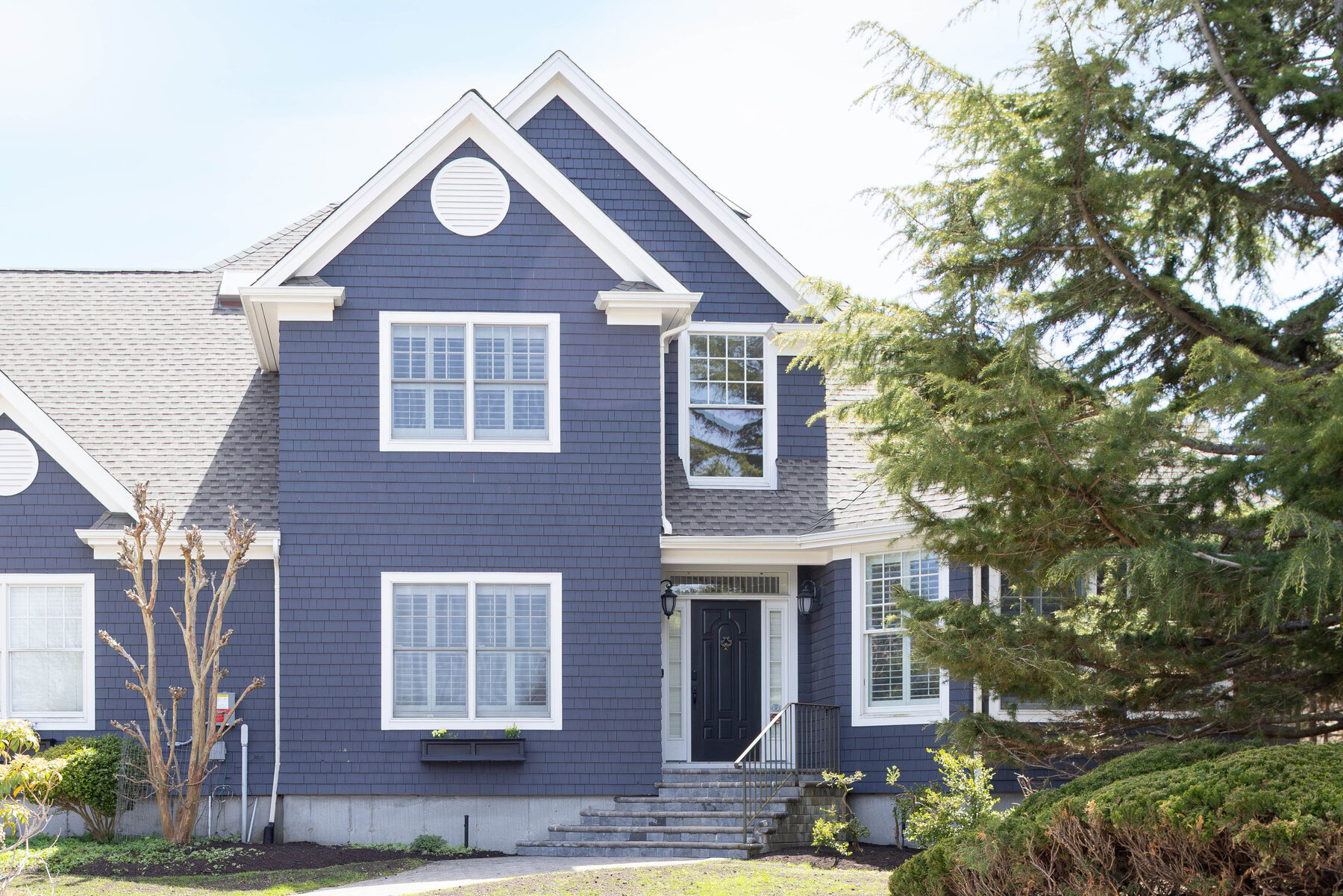 Slate-blue shingle exterior of the home