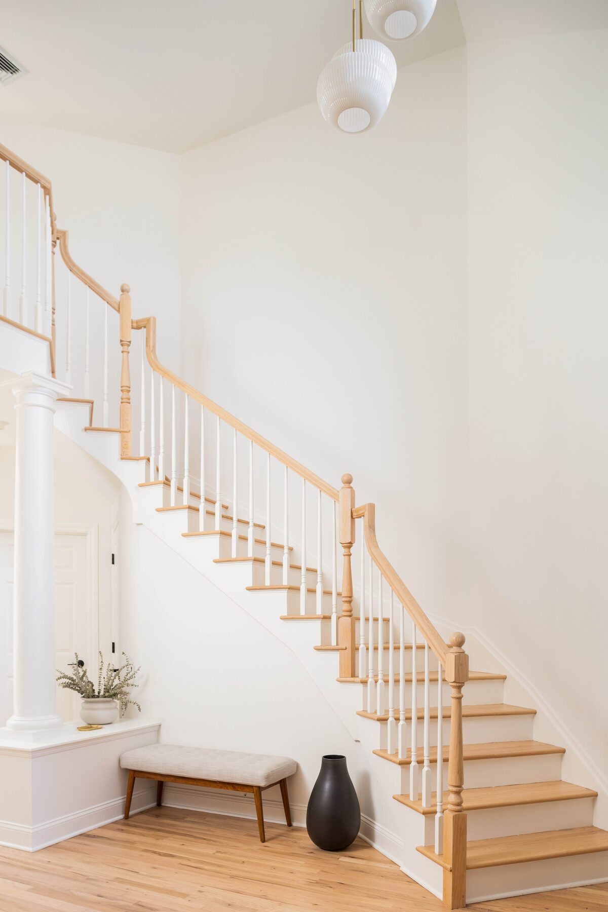 Open-tread staircase with sculptural bench