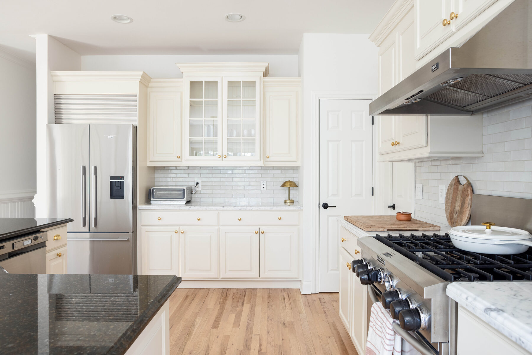 Refreshed kitchen with stainless appliances and stone counters