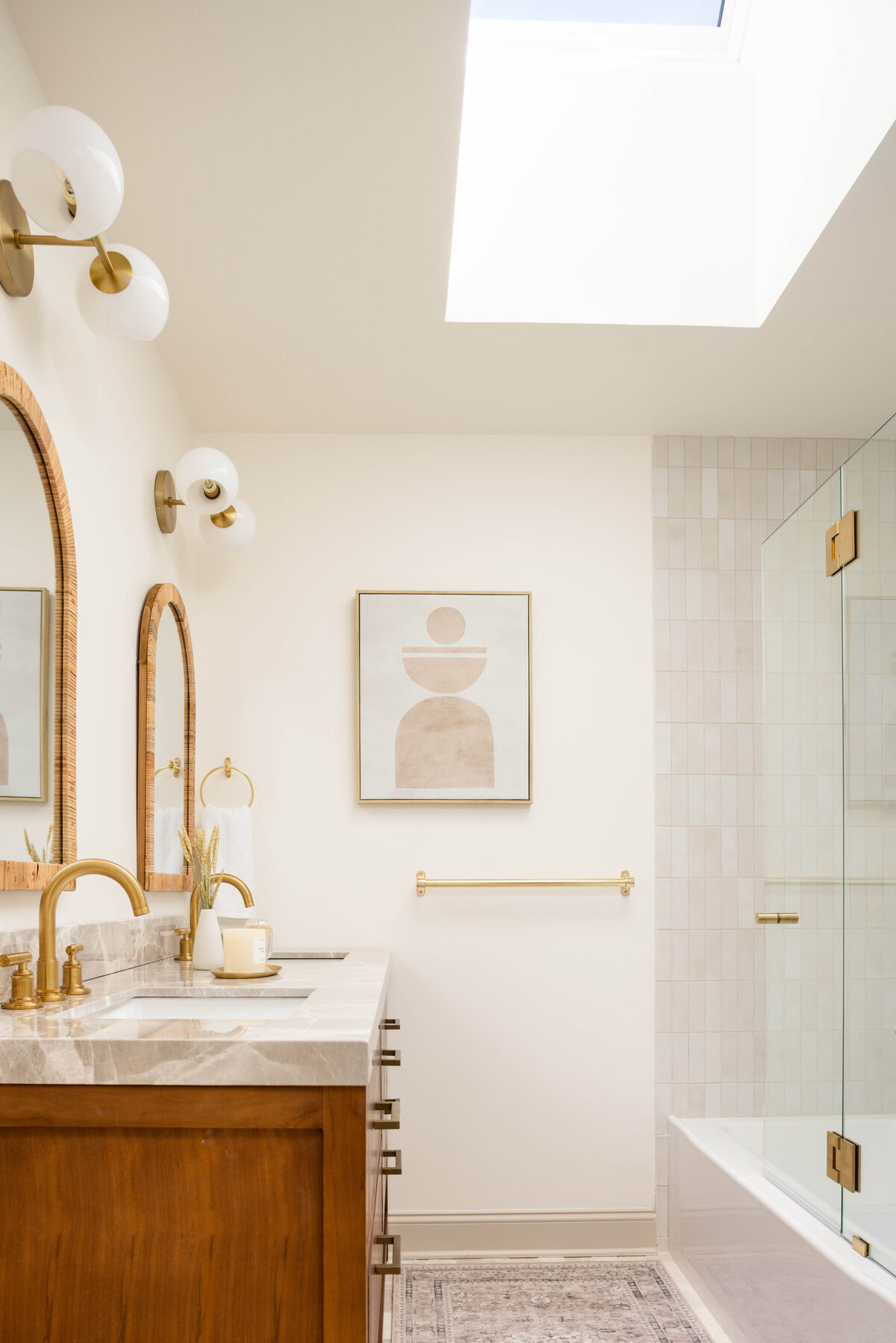 Guest bath — soaking tub beneath an opening skylight