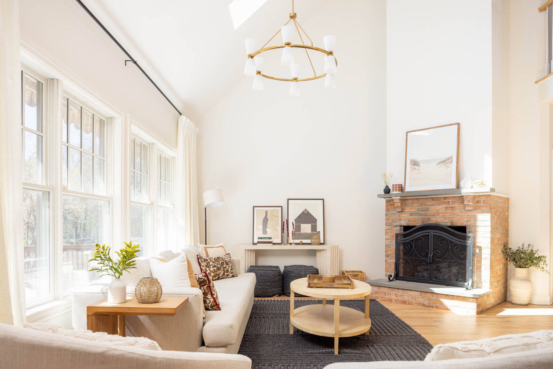 Great room with brick fireplace and vaulted ceiling