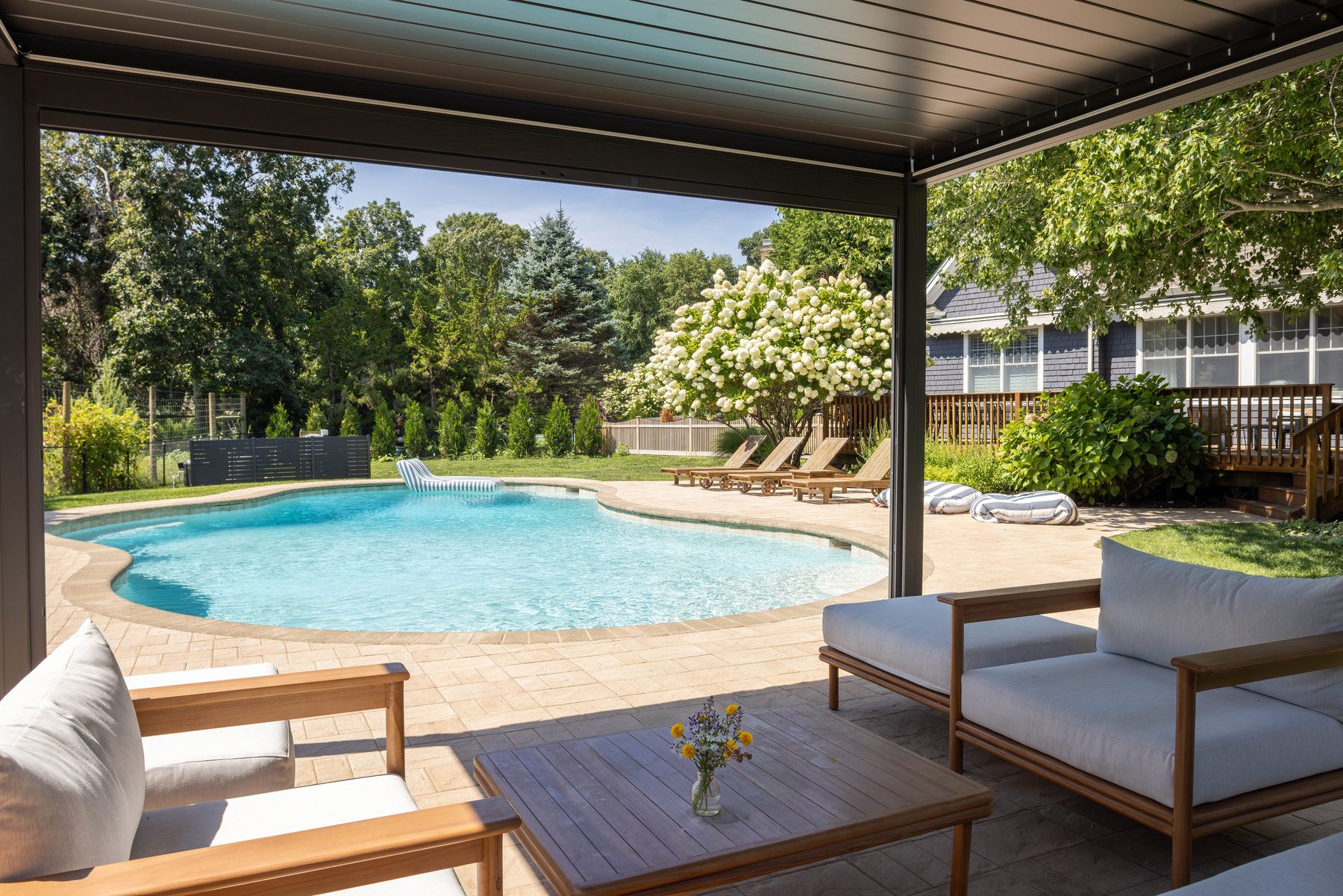 Poolside pergola lounge overlooking the pool