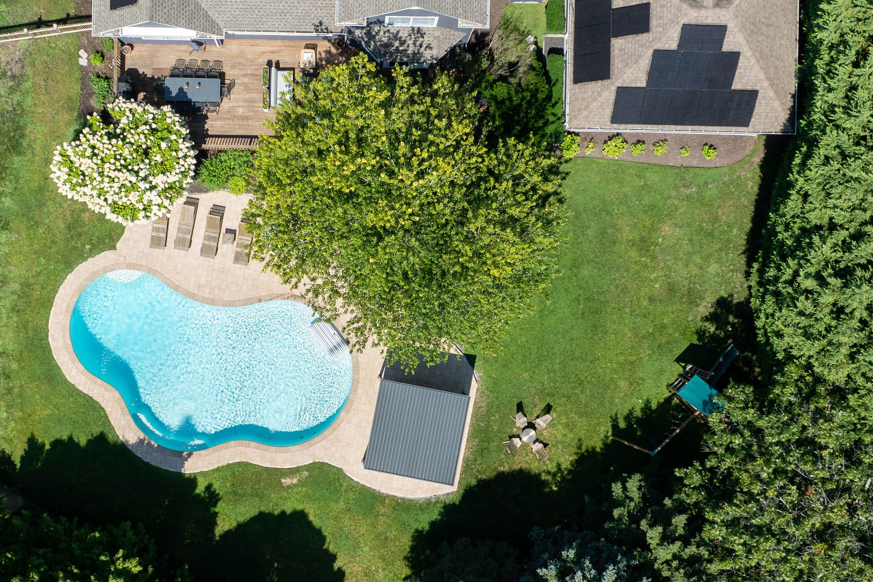 Aerial view — overhead of the pool, deck, and yard